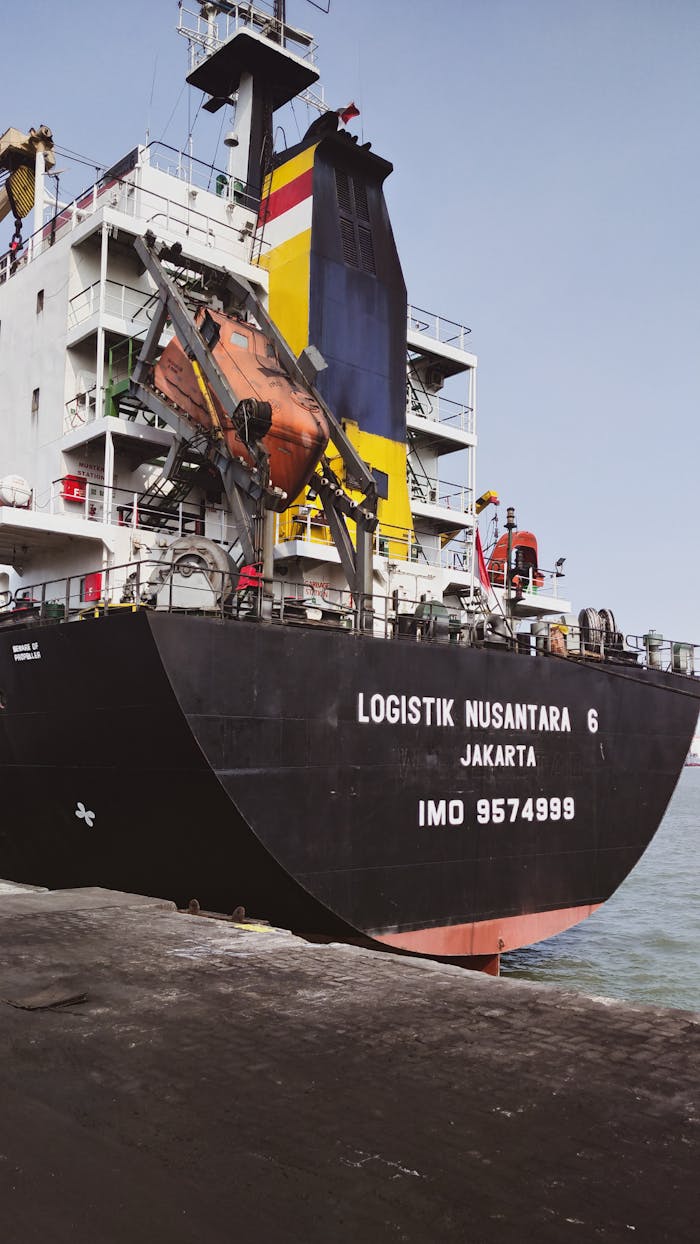 services-04 Docked cargo ship 'Logistik Nusantara 6' at Jawa Timur port, Indonesia, showcasing maritime shipping.
